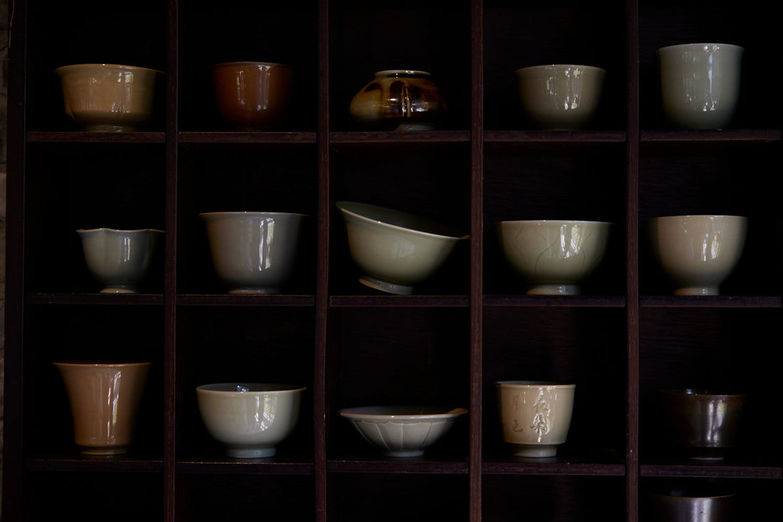 storing handmade ceramic teaware in wooden box