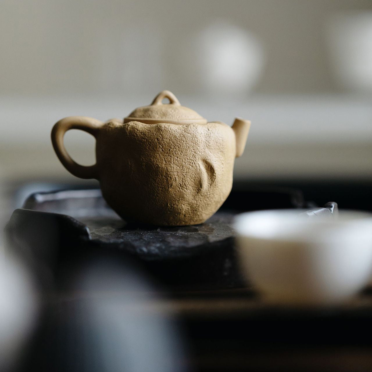 Huangduanni raw ore Xishi handmade teapot on a Gongfu tea tray