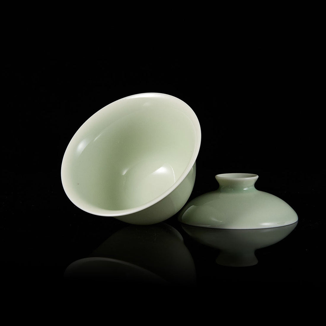 Premium celadon porcelain cup in a classic Gaiwan shape, showcasing the elegant glaze of traditional chinese celadon teaware.