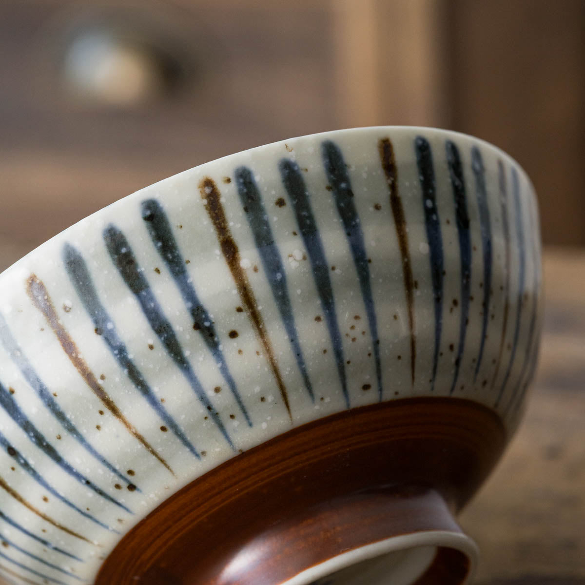 Japanese ceramic bowl with hand-painted striped pattern