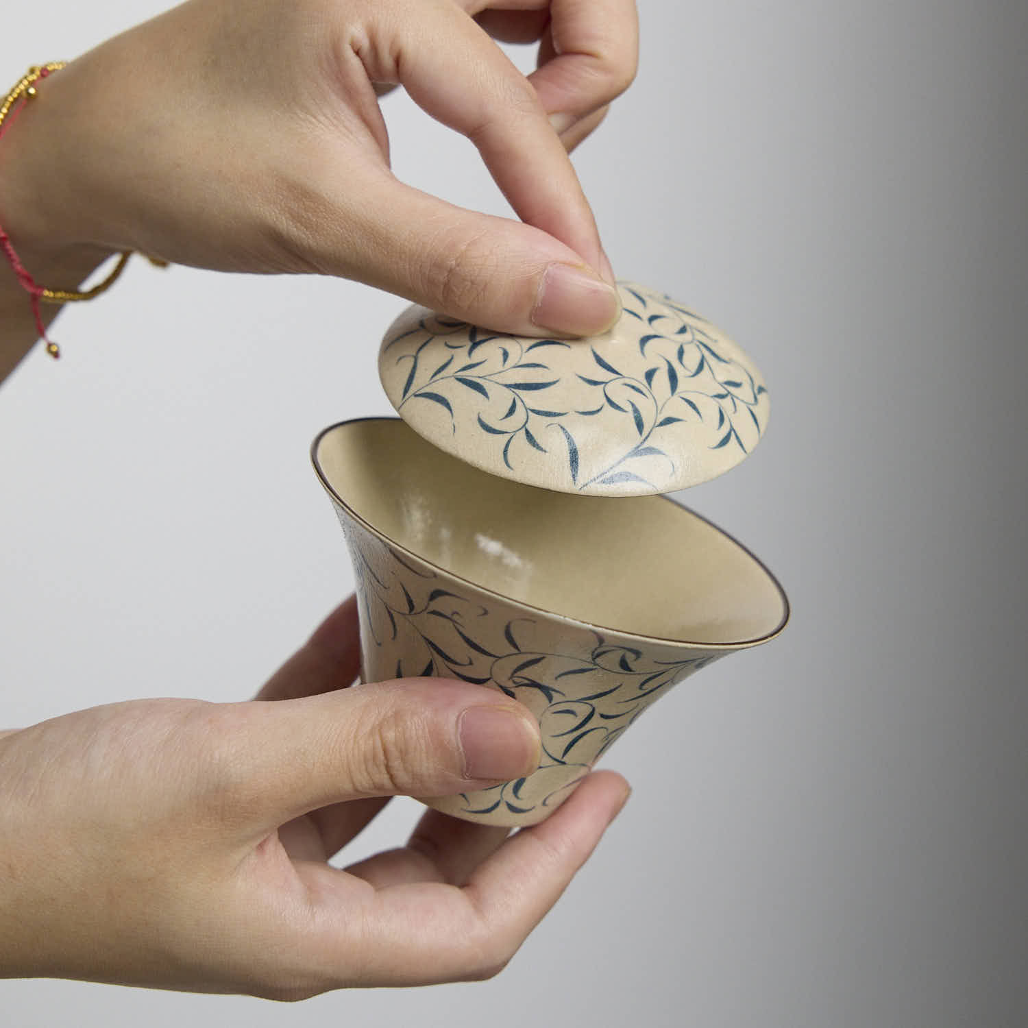 Hand-painted blue and white porcelain gaiwan with spring bud and moonlight design