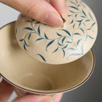 Hand-painted blue and white porcelain gaiwan with spring bud and moonlight design