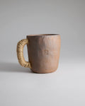Hand-pinched rustic stoneware mug in earth tones with hemp-wrapped handle