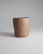 Hand-pinched rustic stoneware mug in earth tones with hemp-wrapped handle