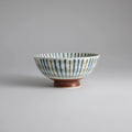 Japanese ceramic bowl with hand-painted striped pattern