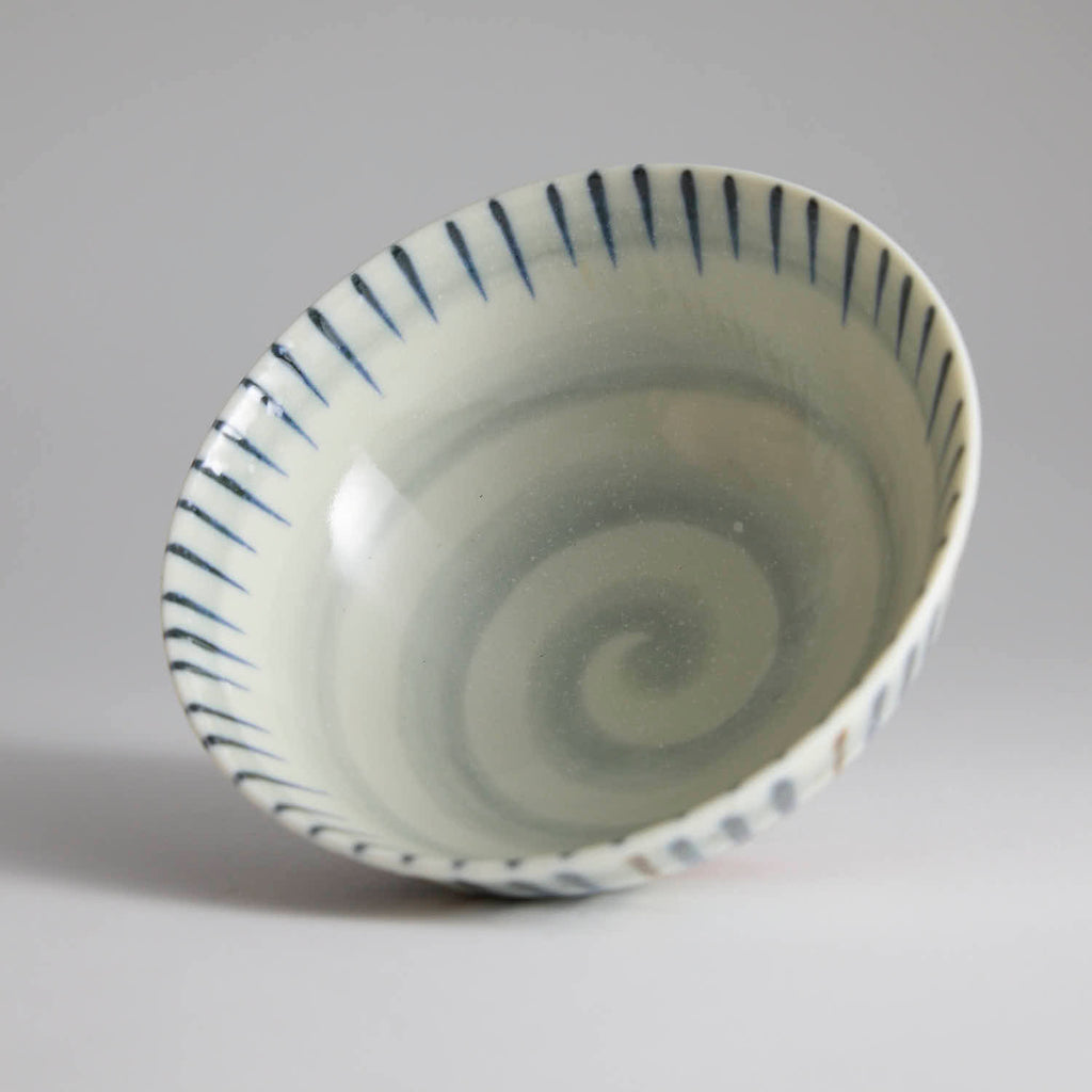 Japanese ceramic bowl with hand-painted striped pattern