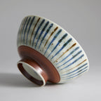 Japanese ceramic bowl with hand-painted striped pattern