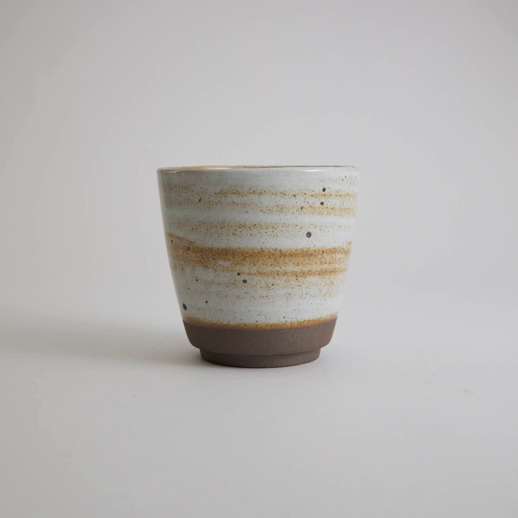 Thick-walled stoneware mug with natural coarse clay texture