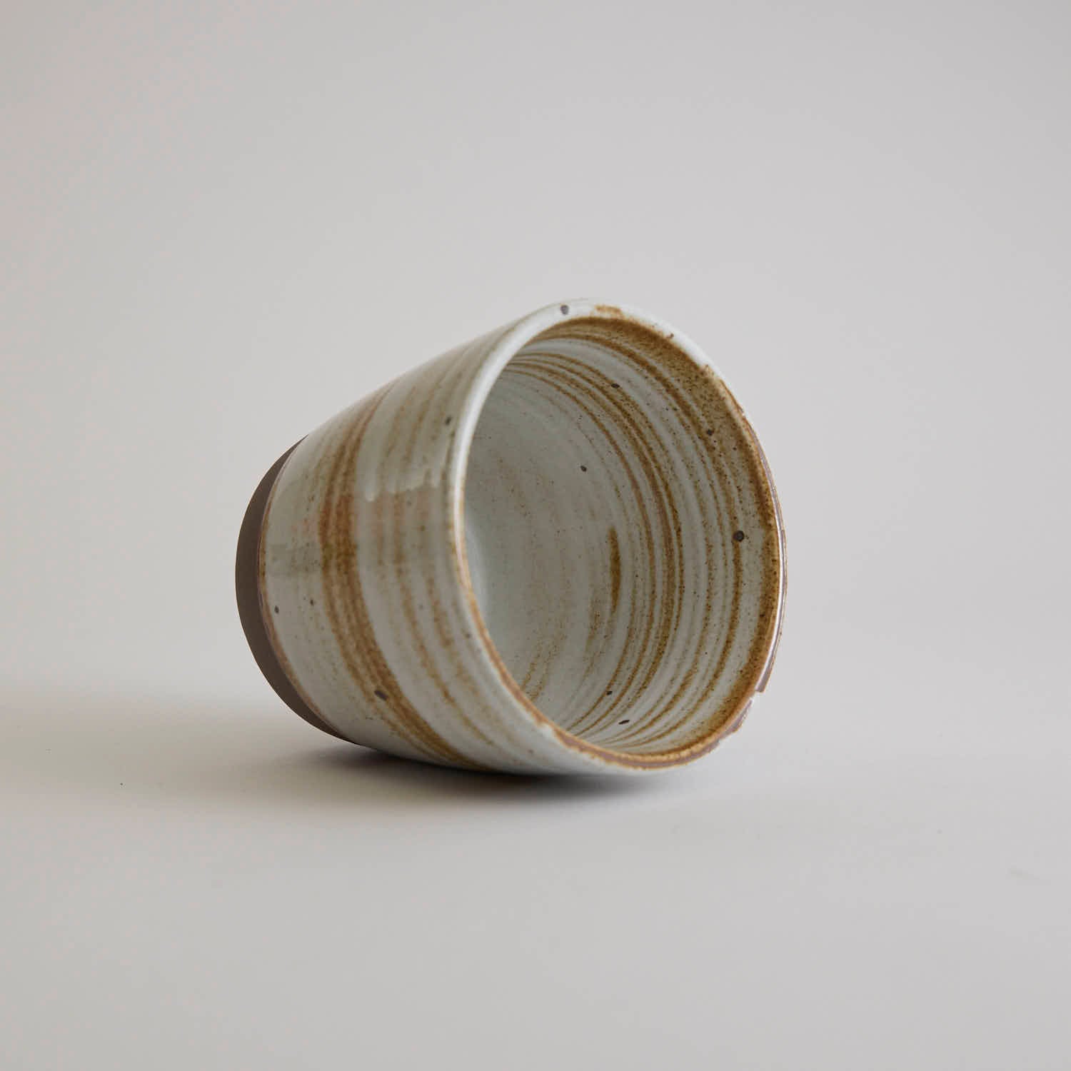 Thick-walled stoneware mug with natural coarse clay texture