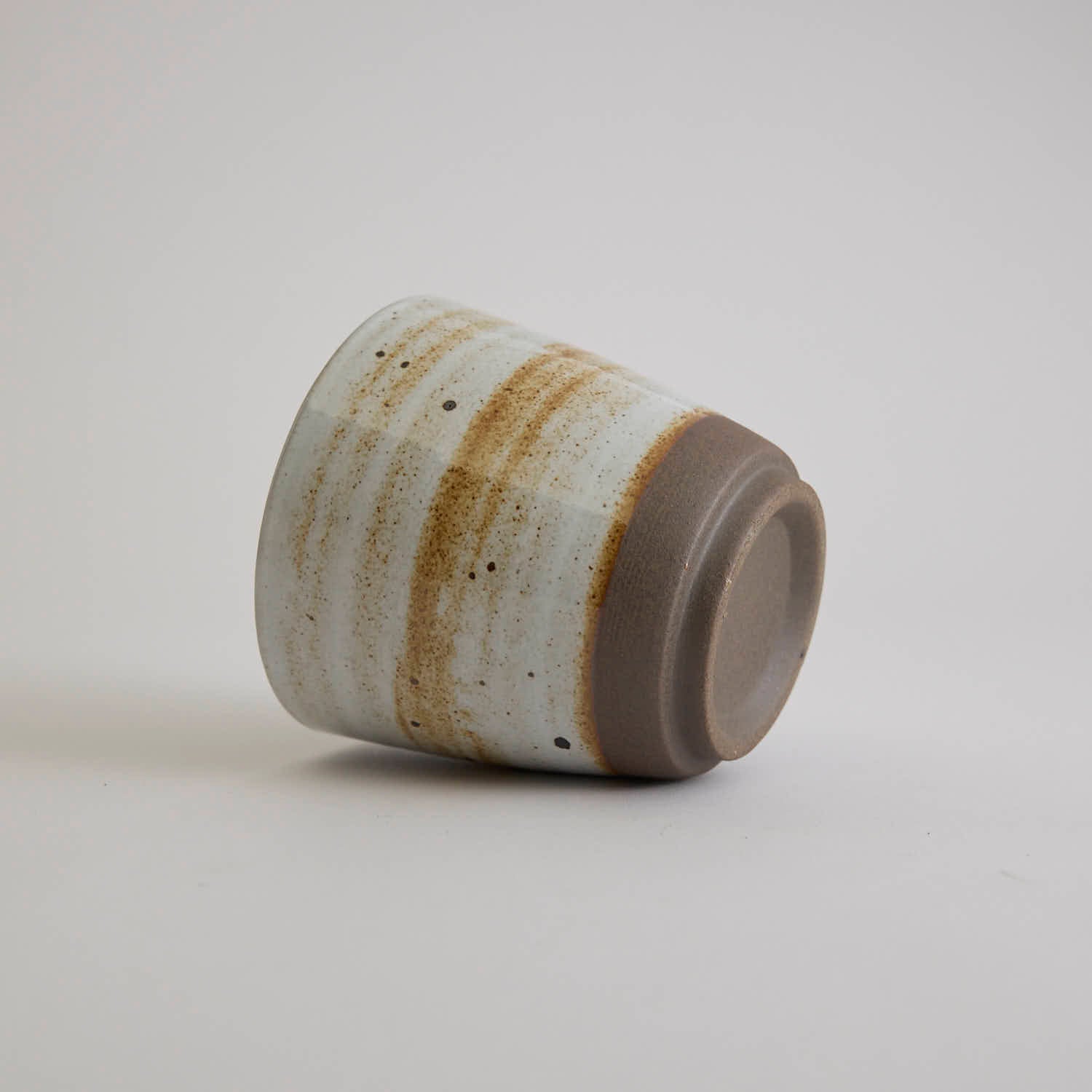 Thick-walled stoneware mug with natural coarse clay texture