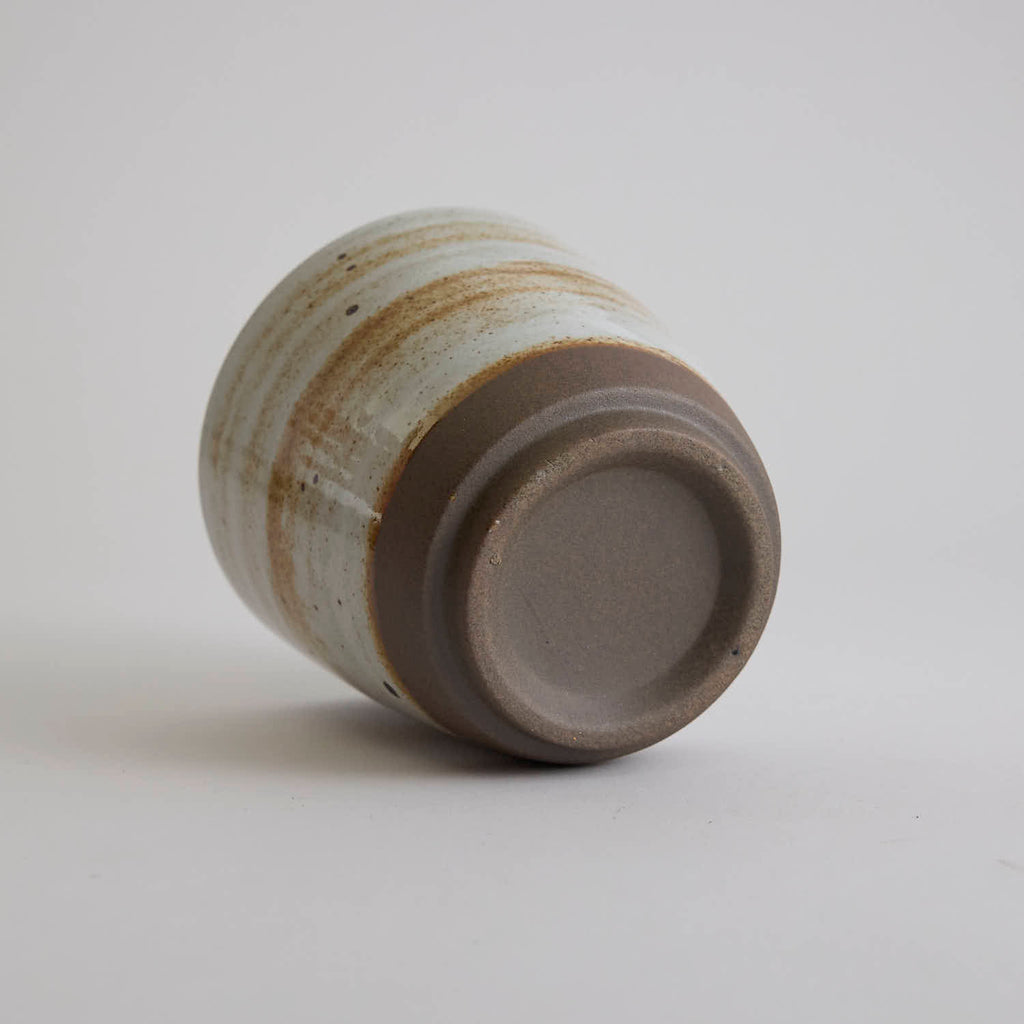 Thick-walled stoneware mug with natural coarse clay texture