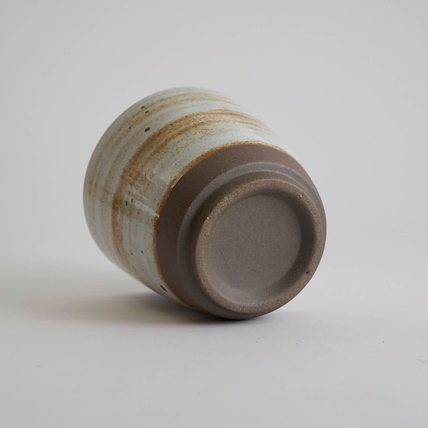 Thick-walled stoneware mug with natural coarse clay texture