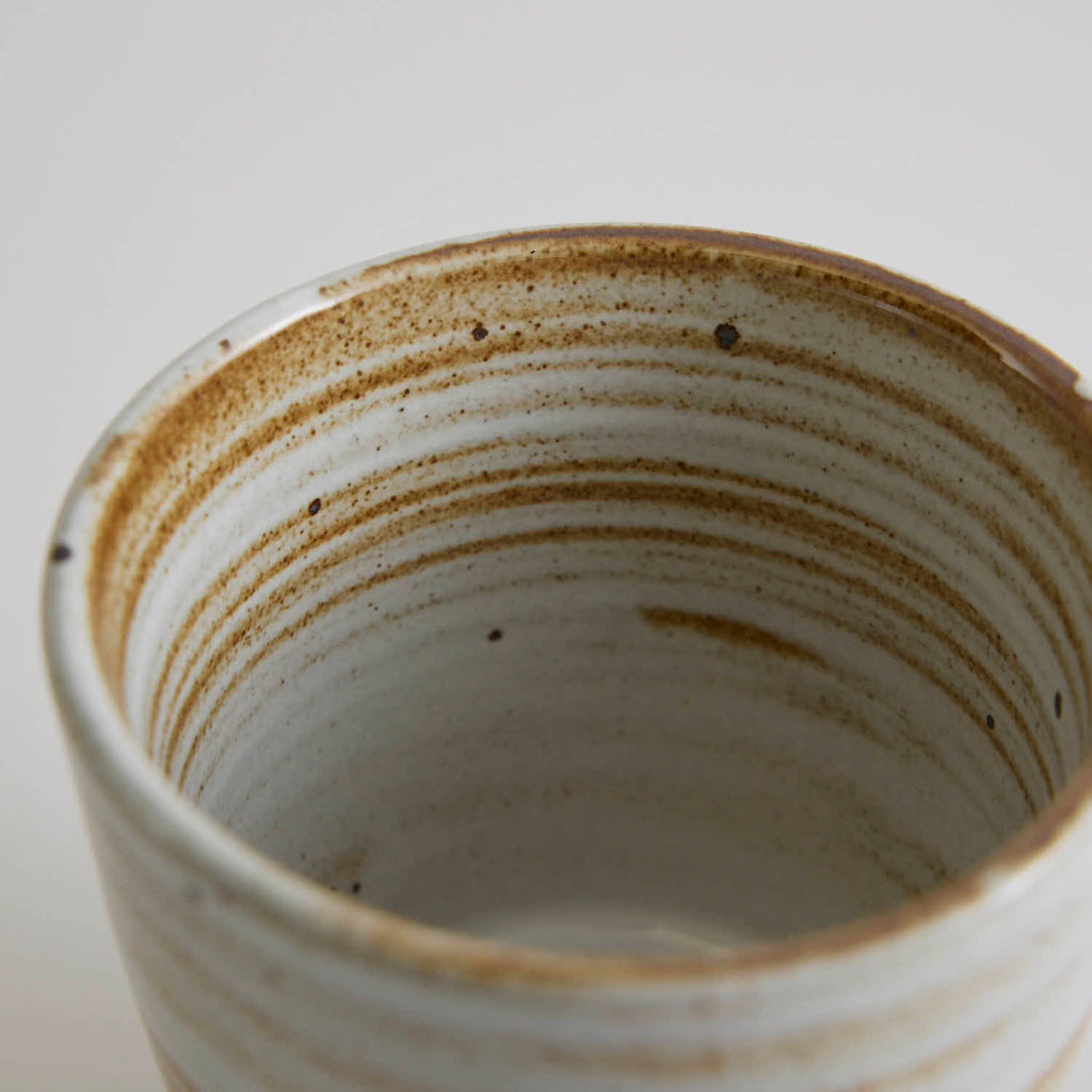 Thick-walled stoneware mug with natural coarse clay texture