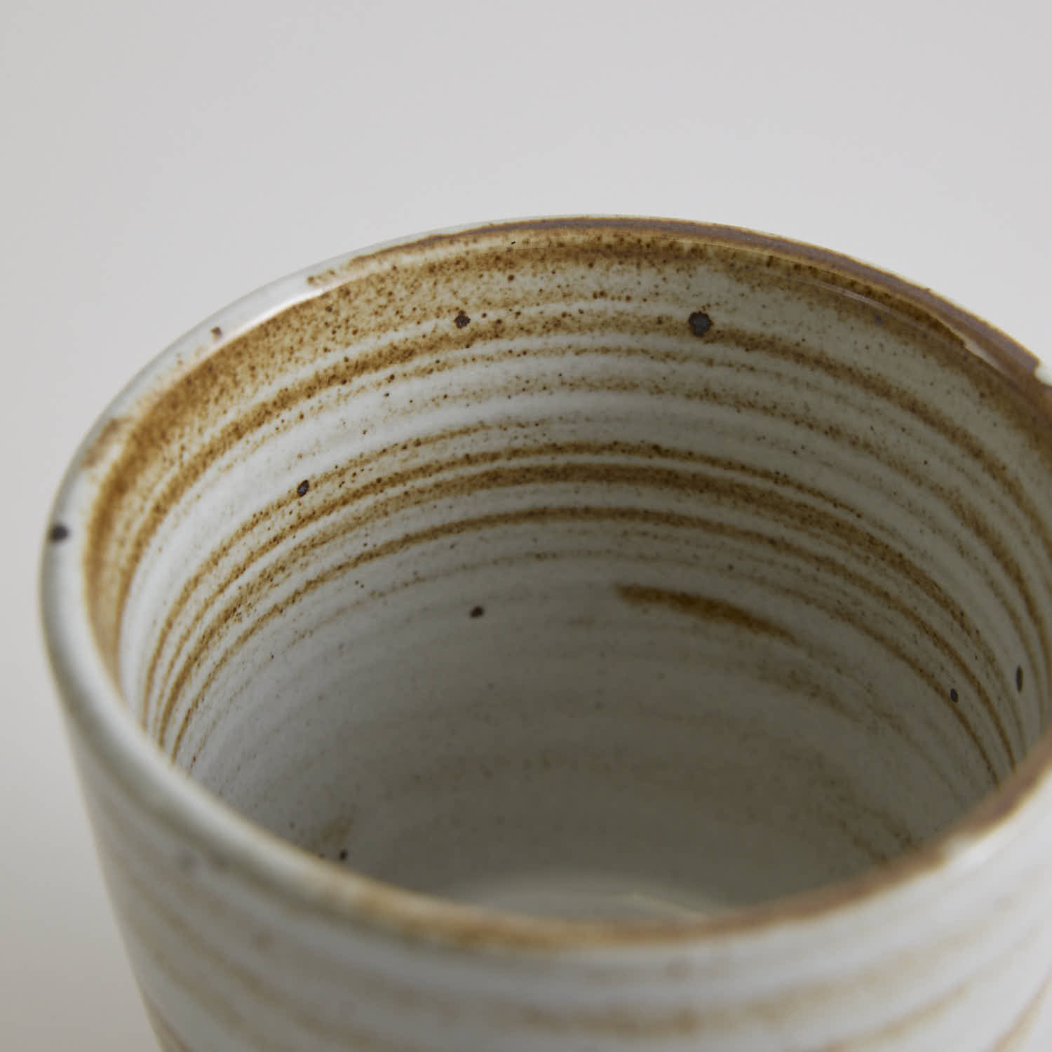 Thick-walled stoneware mug with natural coarse clay texture