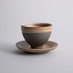 Wood-fired stoneware master cup with natural ash markings and Japanese style