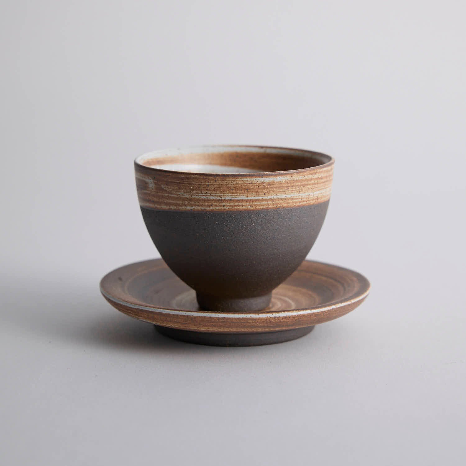 Wood-fired stoneware master cup with natural ash markings and Japanese style