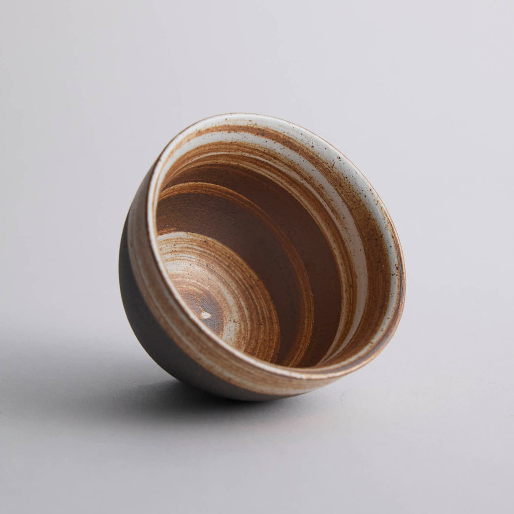 Wood-fired stoneware master cup with natural ash markings and Japanese style