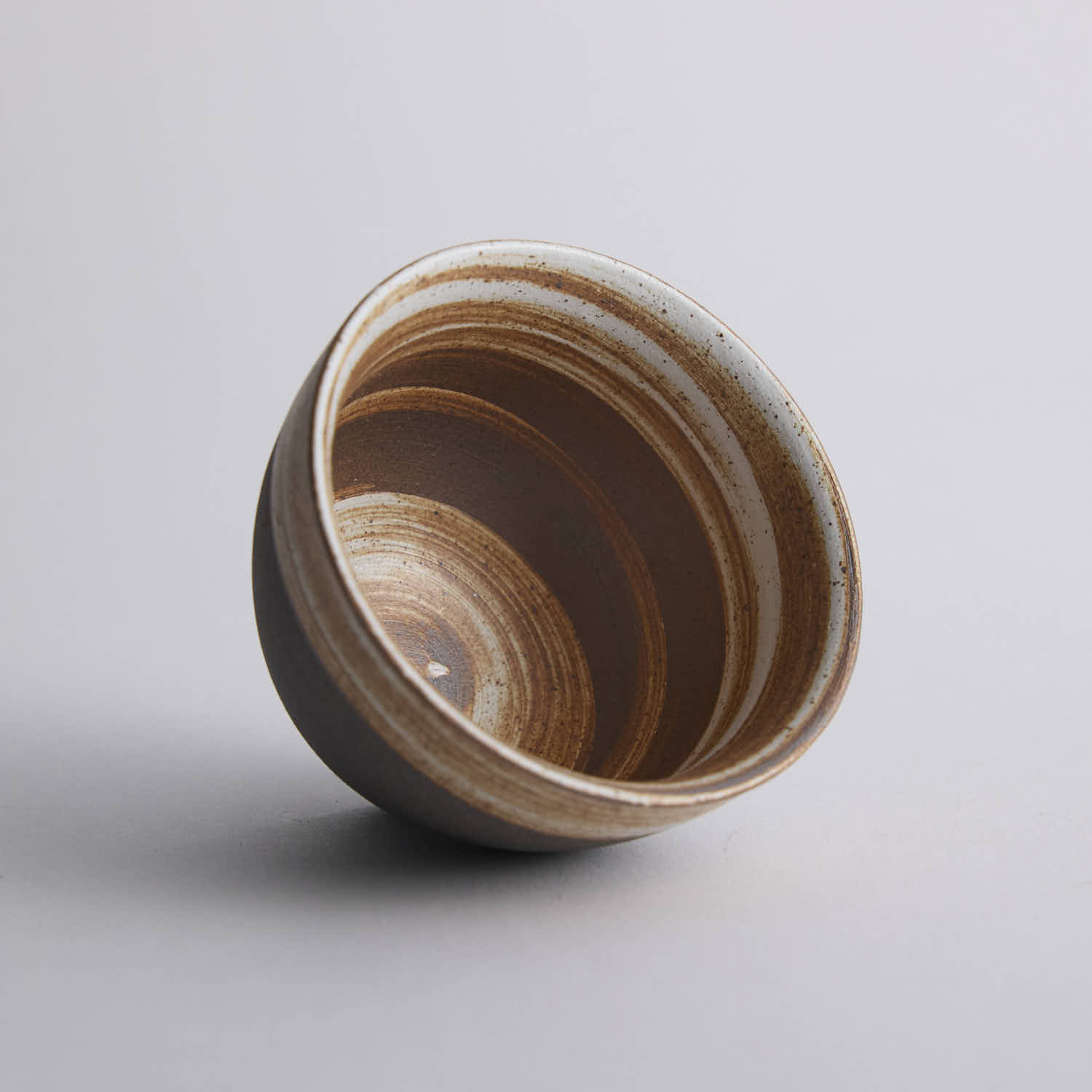 Wood-fired stoneware master cup with natural ash markings and Japanese style