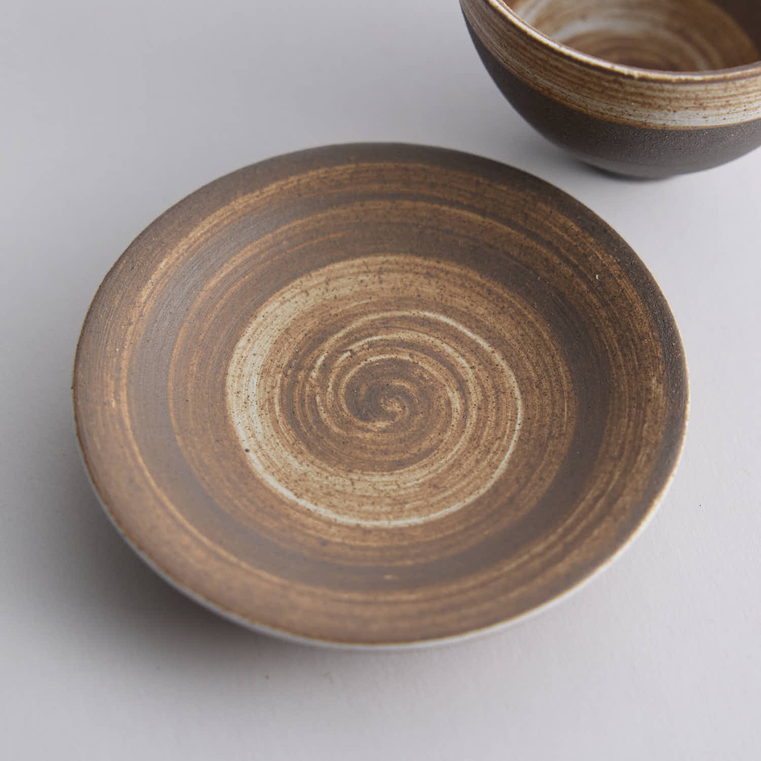 Wood-fired stoneware master cup with natural ash markings and Japanese style