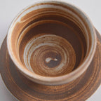 Wood-fired stoneware master cup with natural ash markings and Japanese style