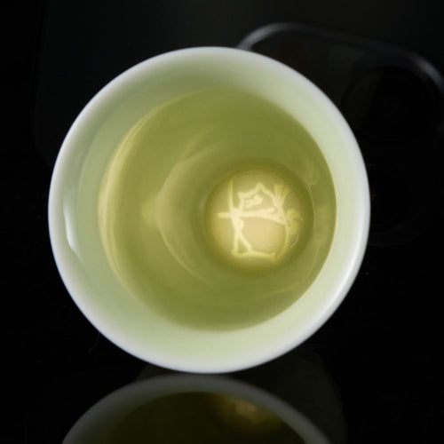Banana Leaf Celadon Cup with Cabbage Relief and Hidden Cat Motif

