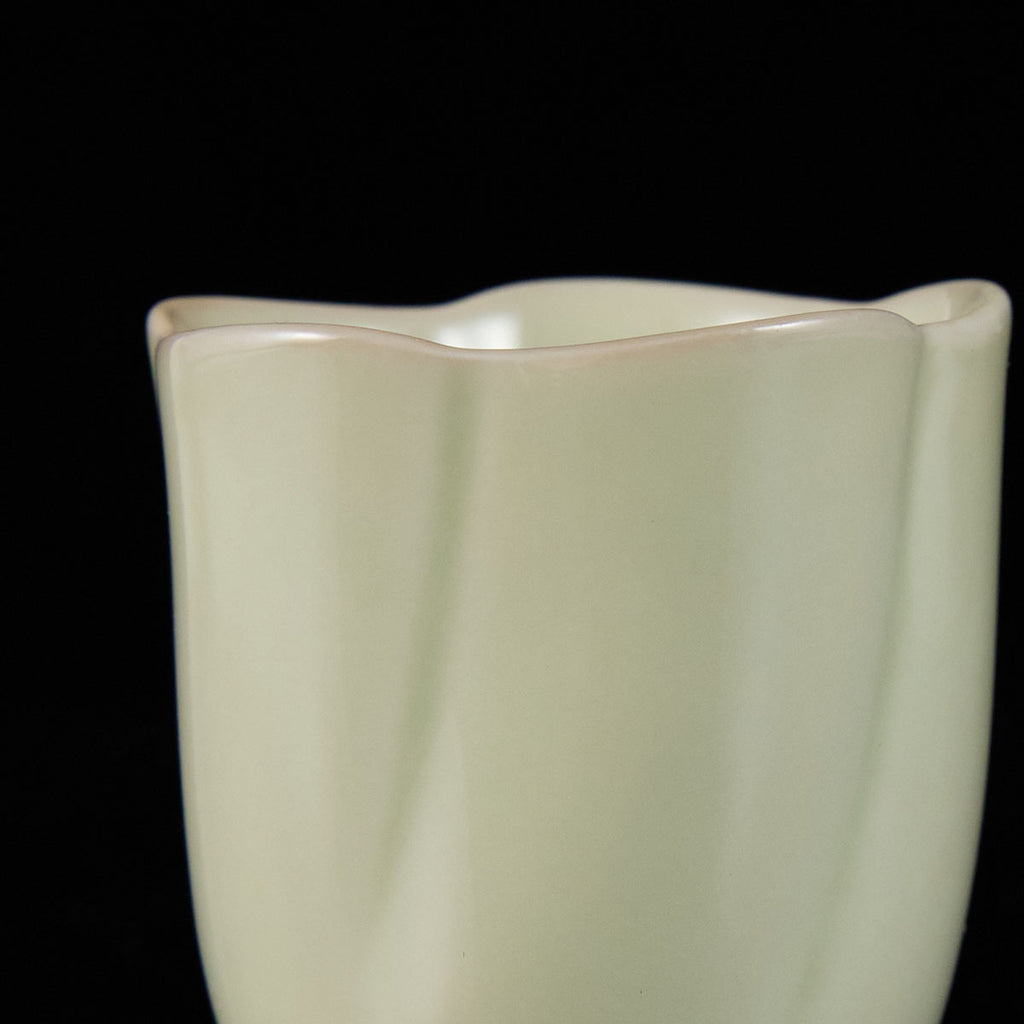 Ou Kiln five-petal blossom rim teacup with wave-shaped floral edge and elegant ceramic finish.