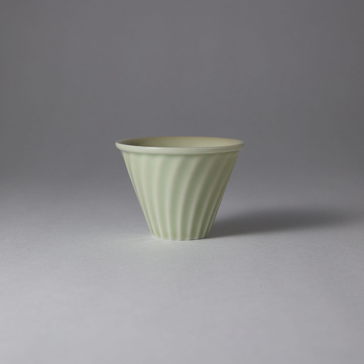 Hand-engraved wave motif teacup inspired by Song-Yuan ceramic art