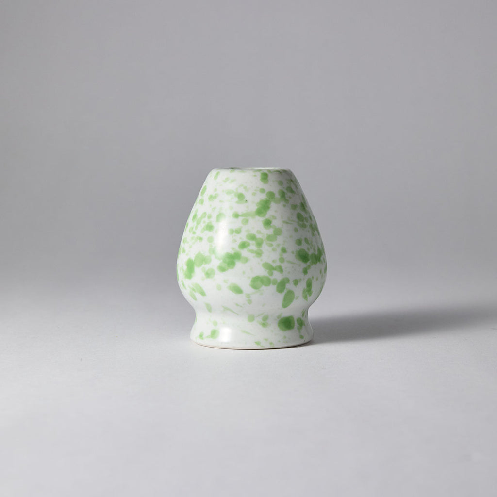 Galaxy-speckled matcha tea set with chawan, bamboo whisk, stand, and scoop