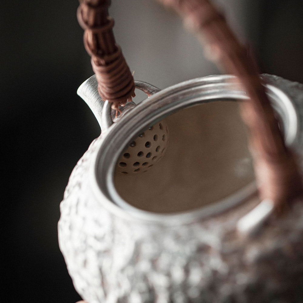 999 Pure Silver Hand-Hammered Chinese Teapot with Wood Handle spout detail handmade Chinese pottery