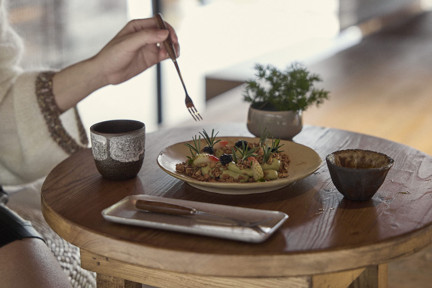 RouseClay - A curated collection of artisan ceramic tea sets and handmade pottery, featuring unique crackle glaze and hand-pinched cups on a serene tabletop.