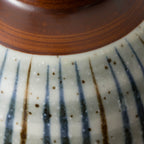 Japanese ceramic bowl with hand-painted striped pattern
