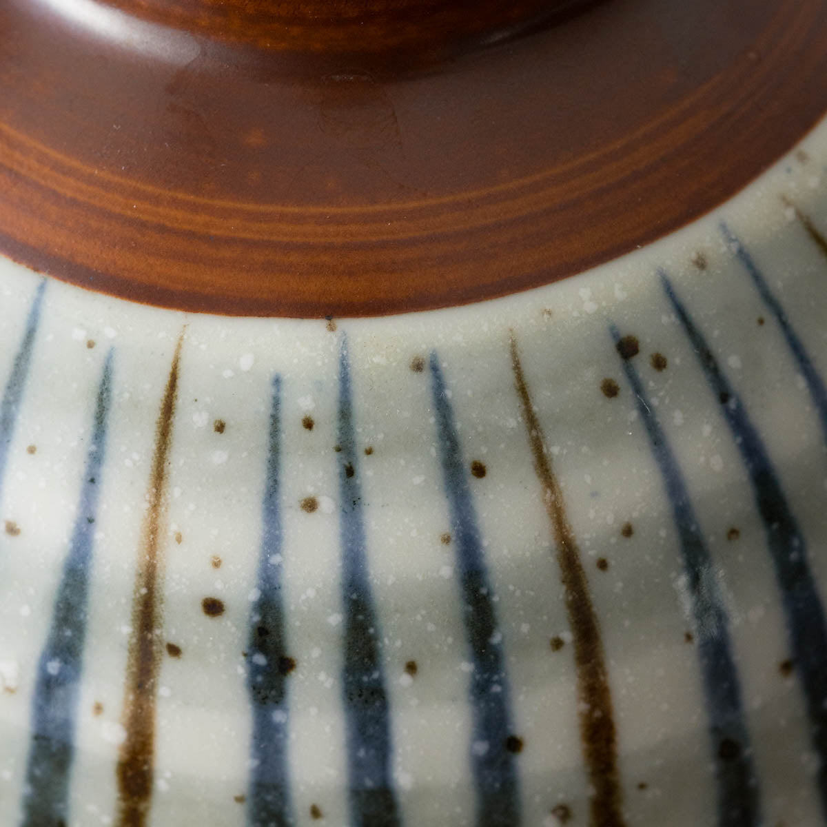 Japanese ceramic bowl with hand-painted striped pattern