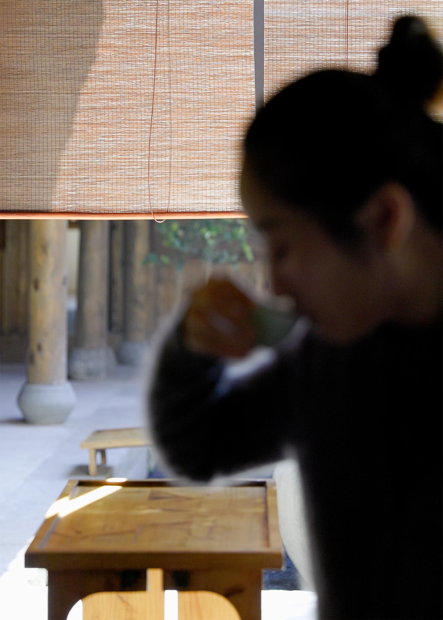 morning tea ritual with handmade ceramic cup person enjoying chinese tea slow living moment