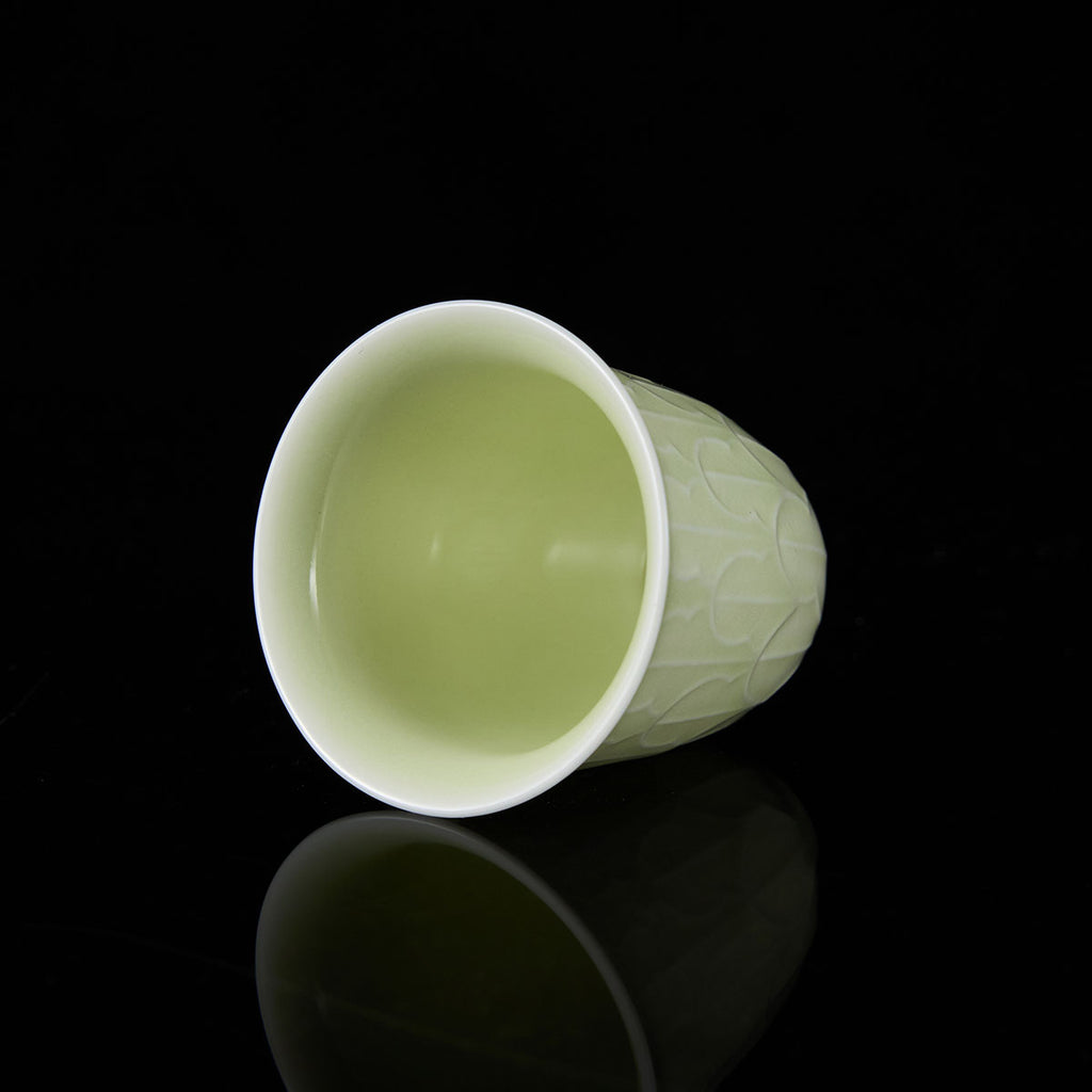Ou Kiln banana leaf celadon teacup side view handmade Chinese ceramic
